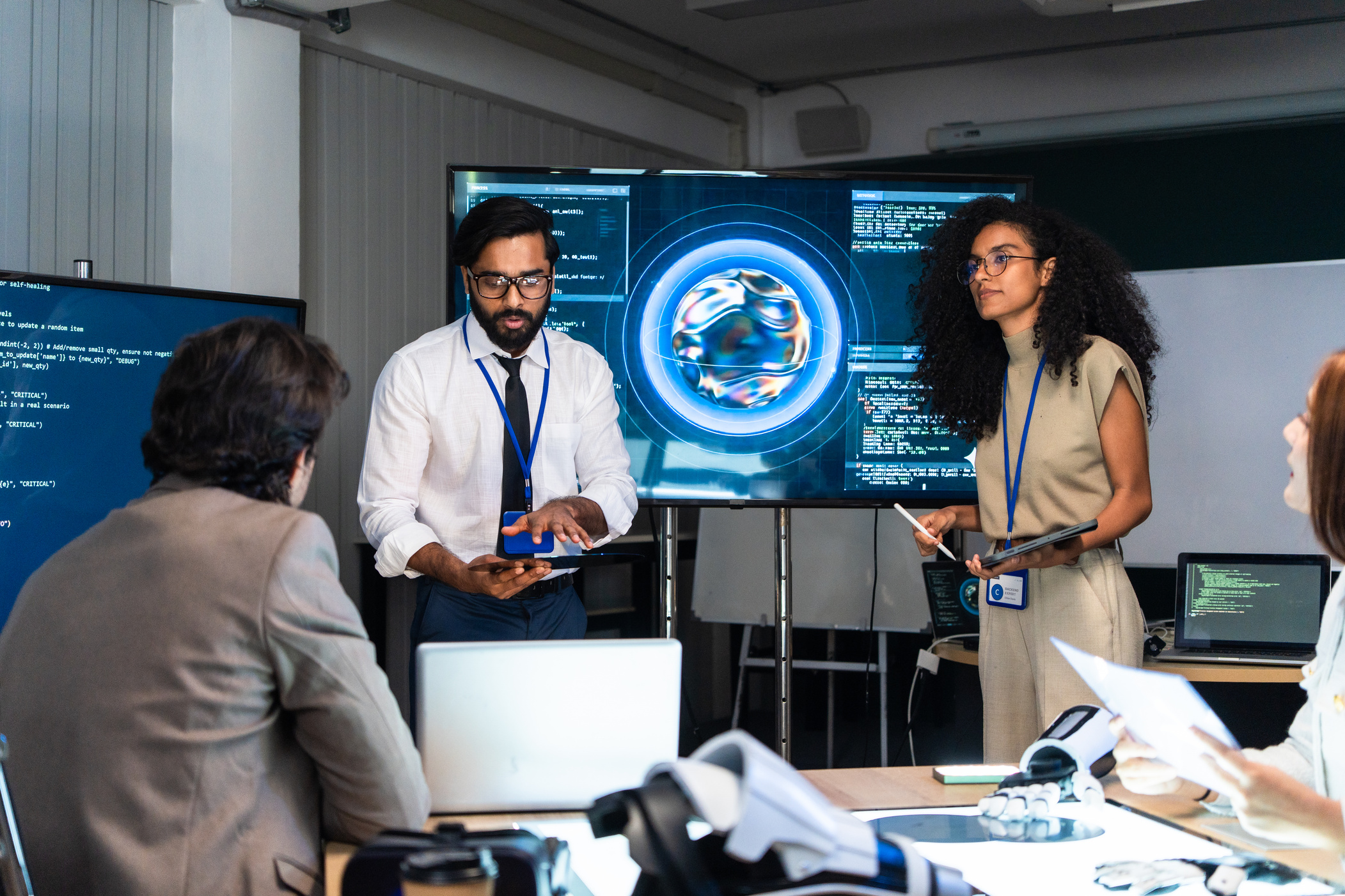 Enterprise technology team reviewing data on a large display