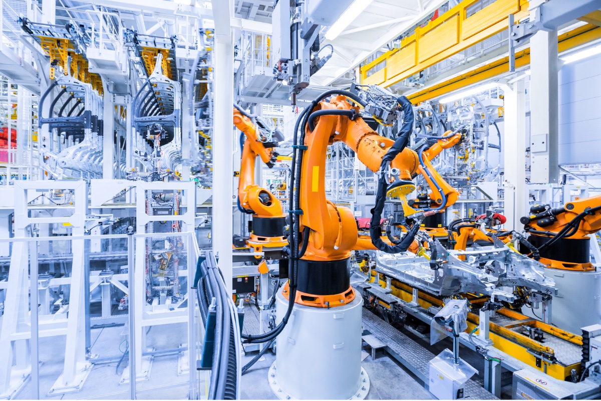 Robotic arms on an automotive assembly line