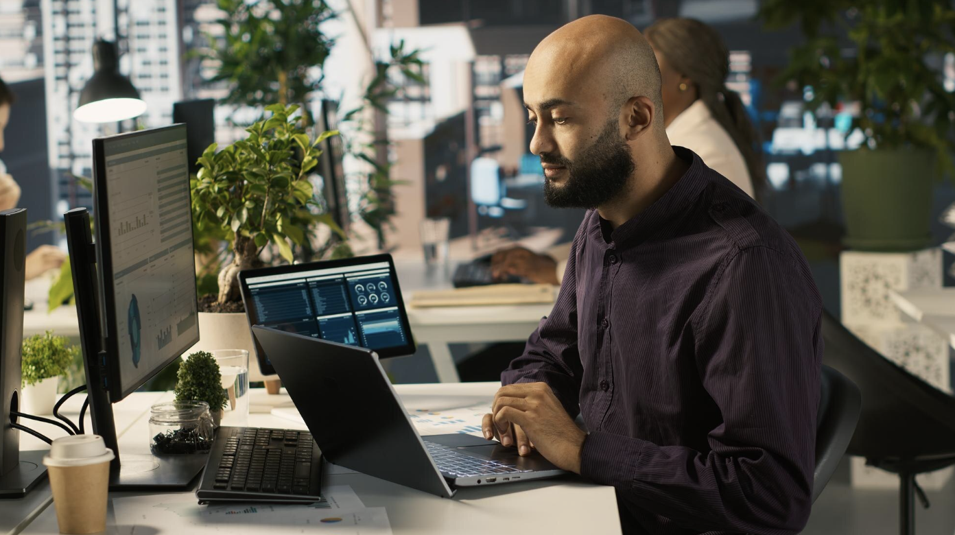 Professional working across automation dashboards